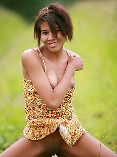 Dark-skinned babe with exotic looks and nubile physique.