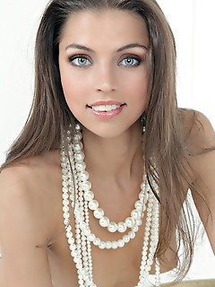 Classic white setting graced by an elegantly beautiful brunette.