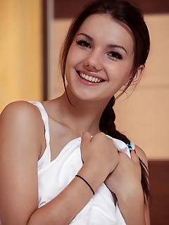 Iva with a charming smile on her pretty face, iva takes off her cropped top and lace panty, revealing her nubile body