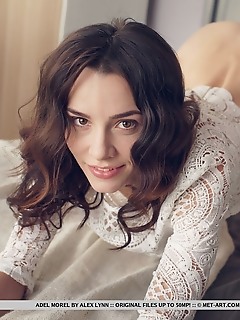 Adel morel newcomer adel morel strips as she displays her   sexy, tight body with sweet pussy on the bed.