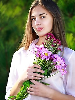 Valencia valencia strips outdoors baring her perky tits and shaved pussy.