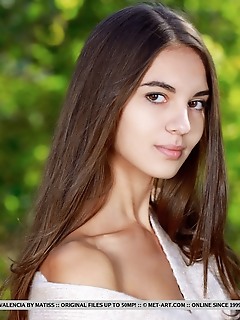 Valencia top model valencia bares her sexy, slender body as she strips in the forest.