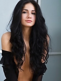 Dark-haired beauty with exotic charms and uninhibited appeal.