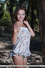 Selina selina playfully poses outdoors baring her beautiful tits.