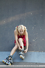 Gloia newcomer gloia bares her shaved pussy as she rides her in-line skates.