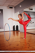 Alexia gymnast alexia shows off her flexible, nubile body as she strips in the studio.