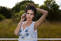 Mona mona delightfully poses outdoors as she shows off her sexy, slender body.