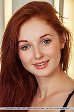 Leona honey redhead leona honey strips on the chair as she bares her petite body and pink pussy.