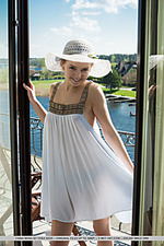 Faina bona faina bona playfully poses in the balcony as she bares her nubile body.