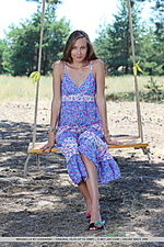 Mirabella alluring mirabella shows off her tight body as she poses on the swing.