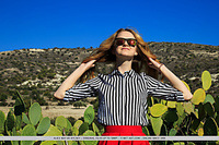 Alice may alice may reveals her sweet pussy as she lifts her red skirt.